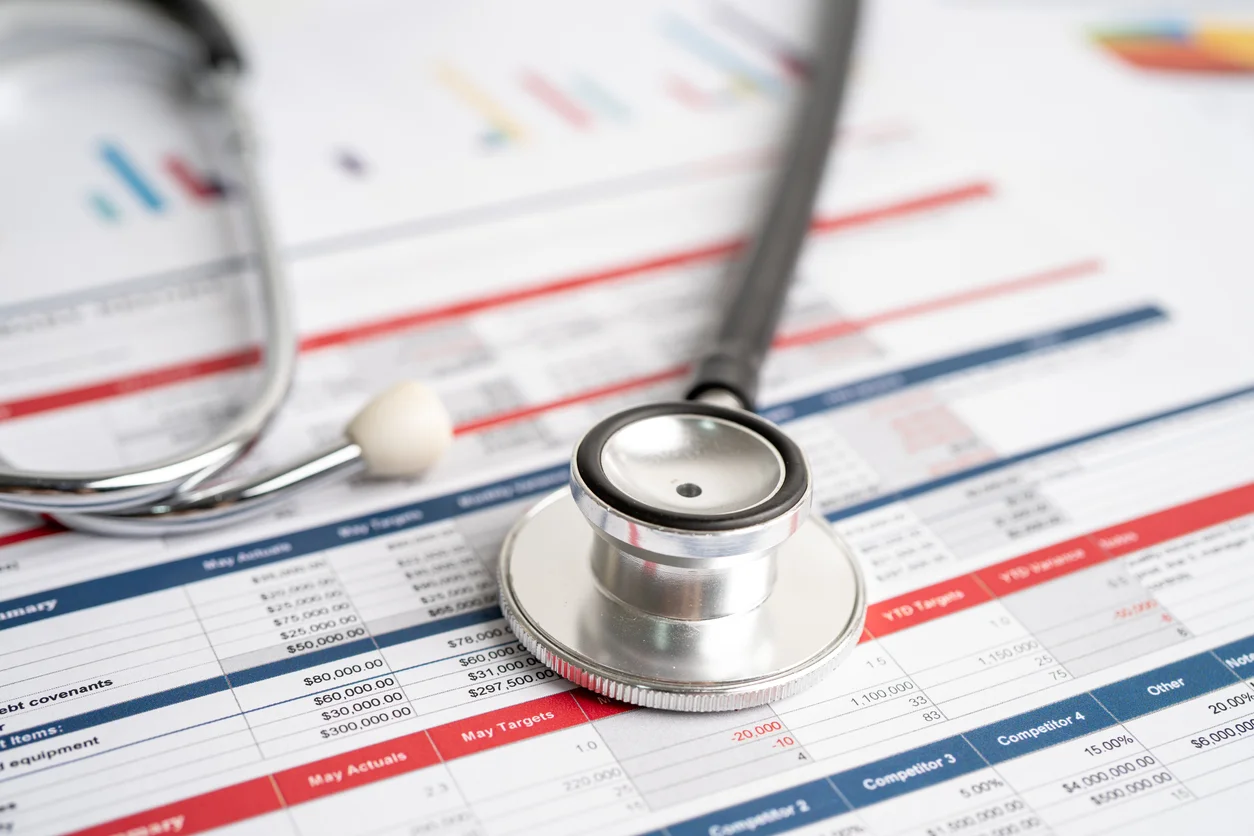 Spreadsheet table paper with stethoscope.